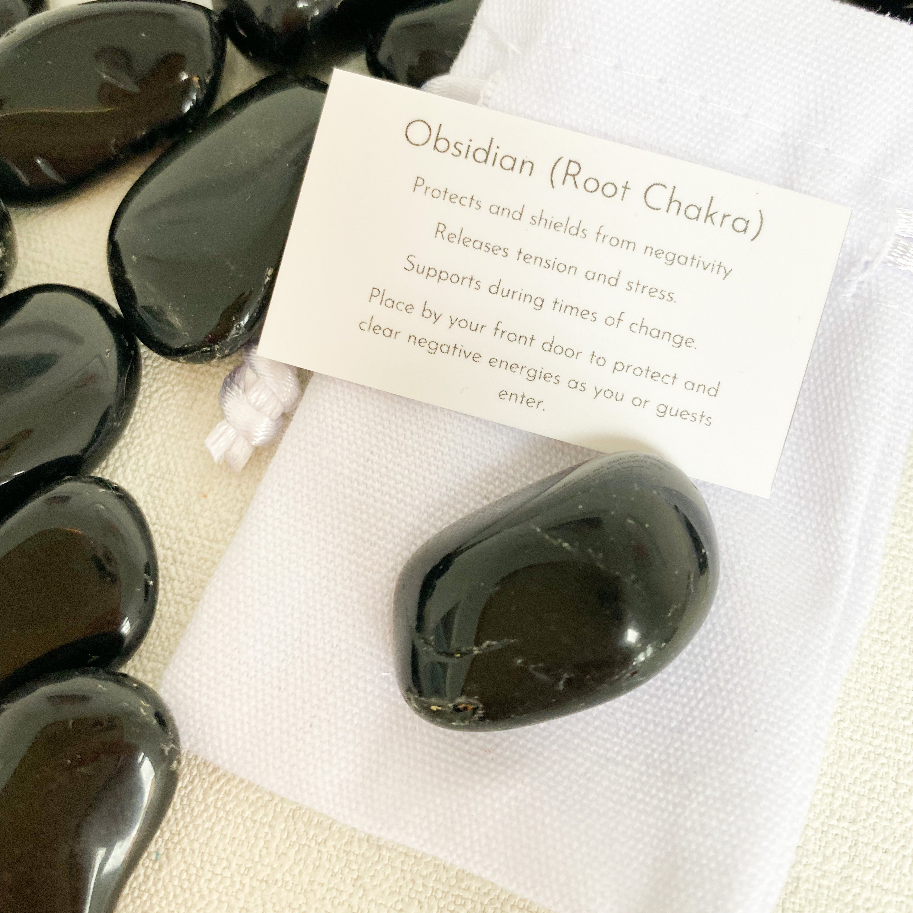 Obsidian tumblestone (with description card)